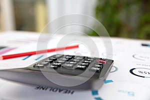 Calculators and pencils in financial materials