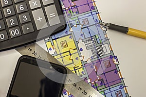 Calcurator, pen and ruler on building house architecture plan drawing blueprint. Planning, measurement and investments concept