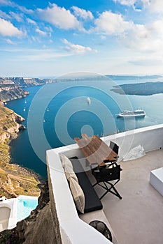 Caldera view and volcano island with cruisers anchored around at Santorini