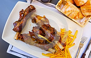 Caldereta de cordero - lamb bone with french fries