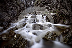 Calderones del Infierno canyon landscape in the north of Spain with silky water effect