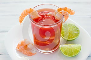 Caldo de camaron, consome de camarones, Shrimp cocktail with lemon mexican sea food in mexico photo