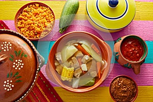 Caldo de res Mexican beef broth in table photo
