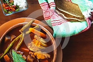 Caldo Tlalpeno, traditional homemade Mexican food. Traditional Mexican soup. Homemade mexican food concept.