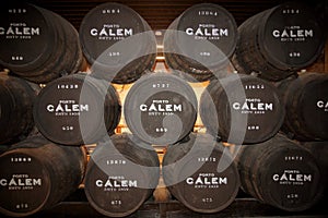 Calem port wine barrels in the caves at Porto Portugal