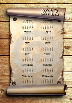 Calendar 2013 Scroll of old paper on wooden boards