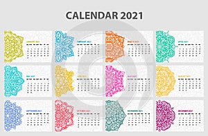 Calendar for 2021 year. Vintage decorative mandala elements. Week starts on sunday. Vintage style template for your design