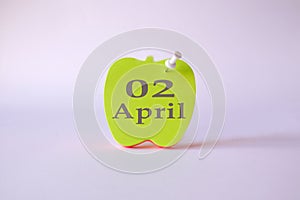 Calendar for April 2 : the name of the month April in English, the numbers 02 on the sheets for writing in the shape of an apple,