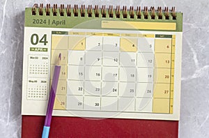 Calendar for April 2024 on a marble background