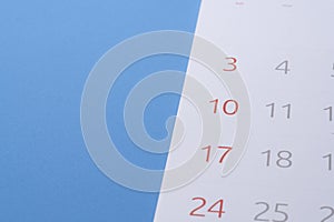 calendar on the blue table background, planning for business meeting or travel planning concept