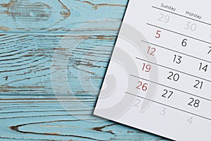 Calendar on a blue wooden background. Important date. Place for text.