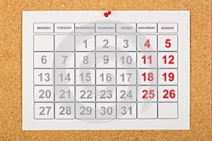 Calendar on corkboard