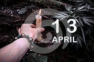 calendar date on the background of an esoteric spiritual ritual. April 13 is the thirteenth day of the month