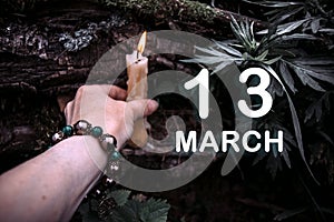 calendar date on the background of an esoteric spiritual ritual. March 13 is the thirteenth day of the month