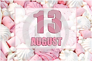 calendar date on the background of white and pink marshmallows. August 13 is the thirteenth day of the month