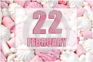 calendar date on the background of white and pink marshmallows. February 22 is the twenty-second day of the month