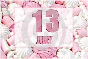 calendar date on the background of white and pink marshmallows. July 13 is the thirteenth day of the month