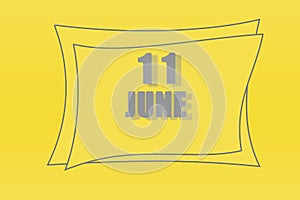 Calendar date in a frame on a refreshing yellow background in absolutely gray color. June 11 is the eleventh day of the month