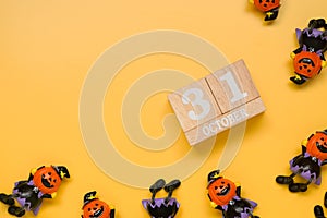 Calendar date of 31 Octorber, halloween holiday with pumpkin toy figures