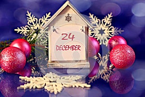Calendar for December 24: decorative house with the name of the month December, numbers 24, pink Christmas balls, decorative