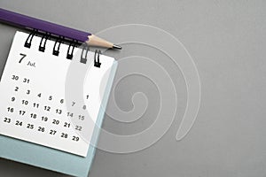 calendar on the gray table background, planning for business meeting or travel planning concept