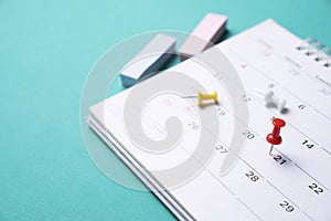 Calendar on the green table, planning for business meeting or travel planning concept