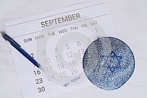 Calendar with kippah. Yom kippur concept.