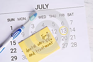 Calendar with a marked date and toothbrush.
