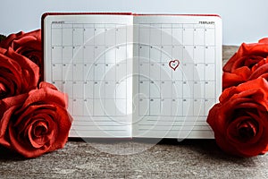 Calendar memo, notebook with bouquet of red roses