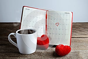 Calendar memo, notebook with the red Heart pillow, coffee cup