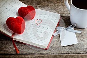 Calendar memo, notebook with the red Heart pillow, coffee cup