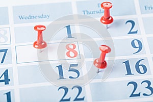 Calendar page for 2021, Concept image of a calendar with red push pins