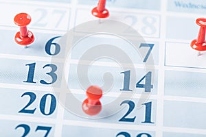 Calendar page for 2021, Concept image of a calendar with red push pins