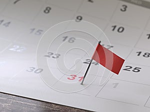 Calendar page with a pin