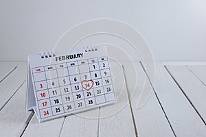 Calendar page with a red hand written heart highlight on February 14 of Saint Valentines day