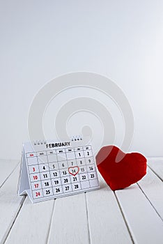 Calendar page with a red hand written heart highlight on February 14 of Saint Valentines day