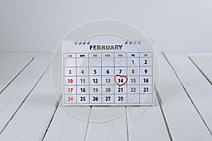 Calendar page with a red hand written heart highlight on February 14 of Saint Valentines day