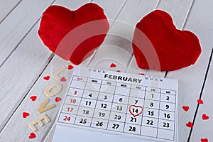Calendar page with a red hand written heart highlight on February 14 of Saint Valentines day