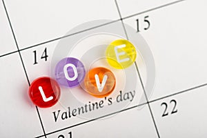 Calendar page with red hearts on February 14 of Saint Valentines day