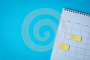 Calendar page with yellow adhesive post it notes