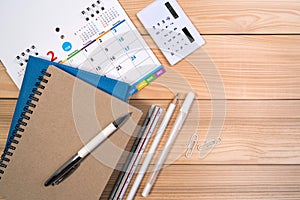 Calendar with pen, calculator, notebook and diary for business finance or appointment concept.