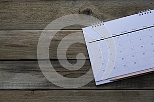 Calendar and pencil on the table, planning for business meeting or travel planning concept
