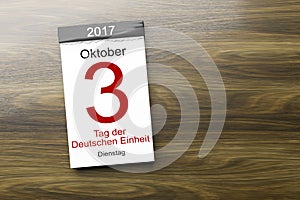 a calendar the 3rd of October Day of German unity text in german photo