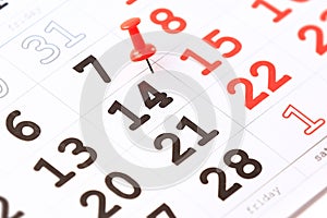 Calendar and red pushpin on 14 February. Valentine's day