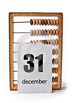 Calendar sheet with date December 31 with wooden bills