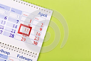 Calendar on the table with green background, planning a business meeting or travel planning concept