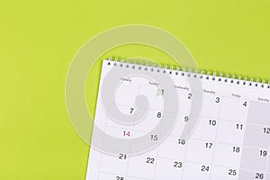Calendar on the table with green background, planning a business meeting or travel planning concept