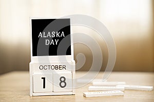 Calendar with words October 18 - Alaska Day in the U.S. state.