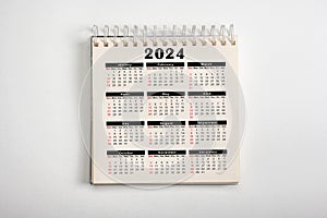 Calendar Year 2024 schedule. 2024 desk calender notepad on white background. 12 months desk calendar. New Year plans for 2024. top