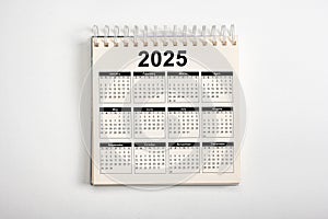 Calendar Year 2025 schedule. 2025 desk calender notepad on light gray background. Resolution, strategy, solution, goal, business